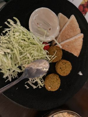 The only thing that was fresh was the plain cabbage. The pita was stale, the falafel was deep fried from the freezer.  at Gojo Paradiso in Kyoto