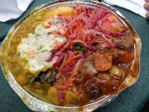 A medium lunch - seitan, chickpeas, cornmeal plus potatoes and salad at Vegan's Delight in Bronx