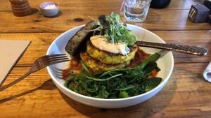 Corn fritters with extras; wilted greens and a hash brown.  at The Sweet Meadow in Echuca
