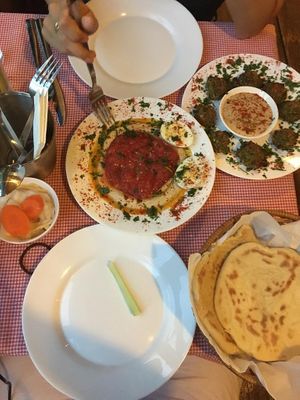 Hummus bowl, falafel, breads and pickles. at Hummusbar in Tbilisi