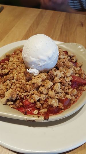 Strawberry rhubarb crisp with vanilla ice cream all vegan at True Food Kitchen in Walnut Creek
