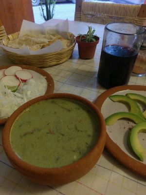 vegan soup with extra avocado, comes with salad bits and crisp bread at Cabuche in Oaxaca