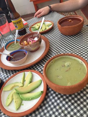 Green and red pozole with avocado  at Cabuche in Oaxaca