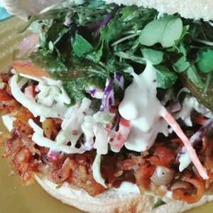 The pulled veg burger, BBQ pulled veg, lemon/coriander slaw, pesto, tomato and greens on a soft bun. at Mr Jackson's Plant Based Food Truck in Tauranga