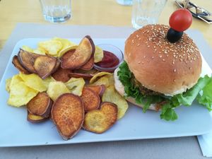Vegan bean burger with potato & sweet potato chips  at Escandinavia Green Spirit in Fuseta