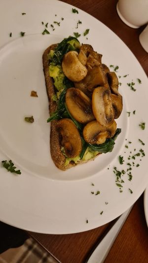 Mushrooms on toasted sourdough with avocado & wilted spinach. at Ambleside Manor in Ambleside