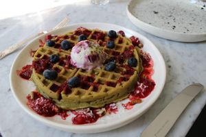 warm glutenfree berry matcha waffle with cold cashew ice cream at Acacia in Frederiksberg