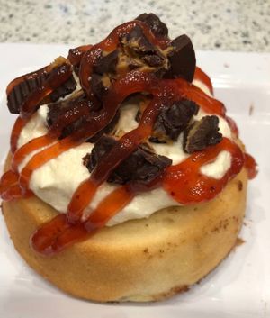 Peanut Butter Frosting with House-made Peanut Butter Cups & Strawberry Jam! at Cinnaholic in Richardson