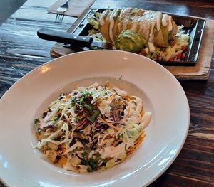 Vegan Daddy's Bowl (front) and vegan chicken chimichanga (back) at Nacho Daddy - The Strip in Las Vegas