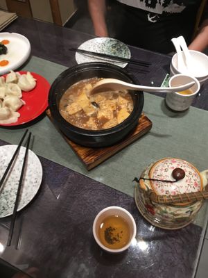 sizzling tofu, teapot and dumplings  at Vegetarian Dumpling in Beijing