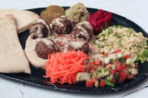 Middle Eastern Mezze - falafel, hummus, muhummara, babaganoush, salads, pickles and fluffy homebaked pita bread at Nourish Cafe in Yangon