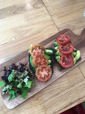 Avocado on toast with pesto  at Nourish Cafe in Yangon