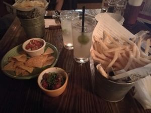 Homemade ginger ale, marinated olives, nachos,  and french fries at Zest Cantina - Odaiba in Tokyo