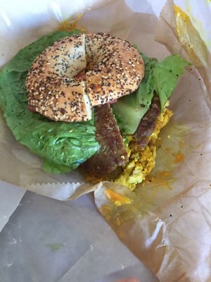 tofu, vegan sausage, vegan cheese and veggies on a bagel at Hudson Street Deli in Providence