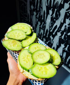 Toasted bagel with vegan cream cheese and cucumber. at Bury Me Standing  in Hobart