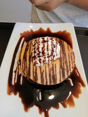 Pancakes with pears and chocolate sauce. at Tweny Leaf in Lisbon