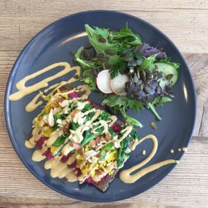 Sprouted buckwheat bruscjetta with spiced beetroot hummus, turmeric sauerkraut, tahini & orange sauce... at The Little Shop of Plenty in Maylands