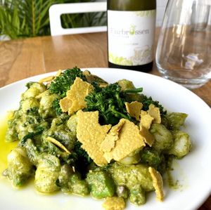 Gnocchi with peas, broccolini, capers, leafy greens, basil & rocket pesto, cashew parmesan.... and a local Sauvignon Blanc. at The Little Shop of Plenty in Maylands