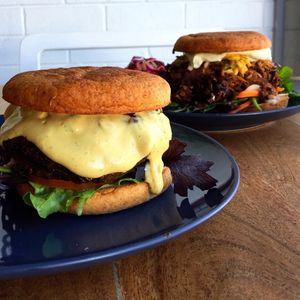 Plant based burgers.... the 'Classic' with cashew 'cheddar' and BBQ jackfruit on gluten free buns. at The Little Shop of Plenty in Maylands