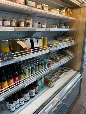 'Grab & go' fridge has plenty of options for cold probiotic drinks, juices, sweets & meals as well as jars of ferments and vegan cheeses. at The Little Shop of Plenty in Maylands