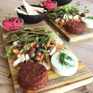 Grazing platters with house made nut cheeses, our own brine cured olives, beetroot hummus, picked veggies, dehydrated herb crackers & flatbreads.  All of our food is gluten free. at The Little Shop of Plenty in Maylands