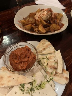 the sausage dish and the patatas bravas   at La Tavernaire in Valencia