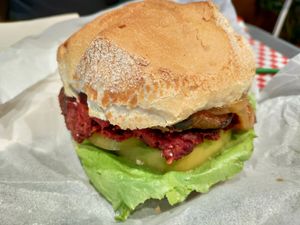 Huge beet burger with breaded cheese at Veggie's World in Andorra La Vella