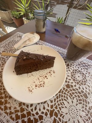 Chocolate cake and oatmilk cappuccino 😍  at PurEssence in Alvor