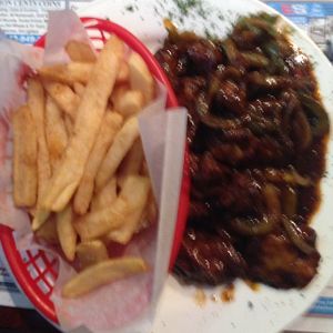 sorry about the blur. jerk ";chicken"; with a side of fries  at Judy's Island Grill in Glen Burnie