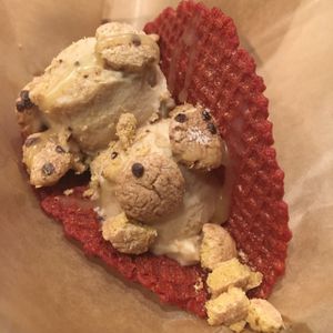 red velvet ice cream taco with cookie butter ice cream, cookie crisps, and coconut condensed milk  at Hug Life in Garden Grove
