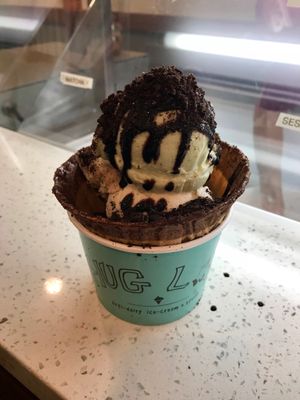 Chocolate dipped waffle cup with honey dew dew child, Reeces peace’s & cookie butter with chocolate syrup & Oreos yummmmm at Hug Life in Garden Grove