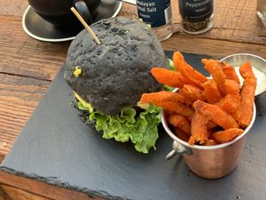 Vegan burger with charcoal bread  at Scheckter's Raw in Cape Town