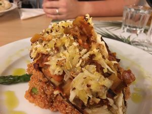 Baked aubergine stuffed with vegetables, served with quinoa at Vegan Express in South West London