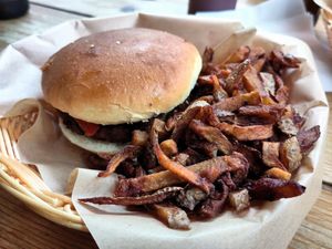 Spicy vegan burger and fries at Holy Moly in Rouen