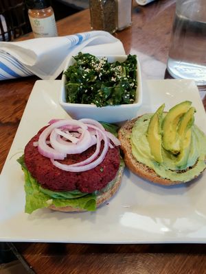 Beet Falafel Burger with side kale salad at Plant Food Supper Club in Idyllwild