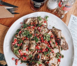 Bread with aubergine, hummus, pesto and pomegranade at ROOS Taste and Smile in Leiden