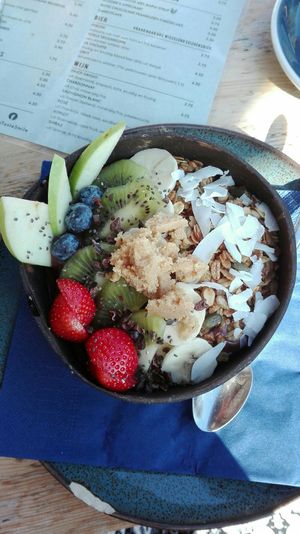 Acai bowl with fresh fruit, granola, coconut flakes and nut butter. at ROOS Taste and Smile in Leiden