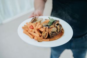 This was one of the less burnt pieces of wellington. Also, note the huge pile of boiled carrots we didn't ask for. at Vegan Food Pimp in Brighton