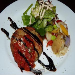 Soy-bean hamburger on plate with vegetables. at Cafe Eight in Tokyo