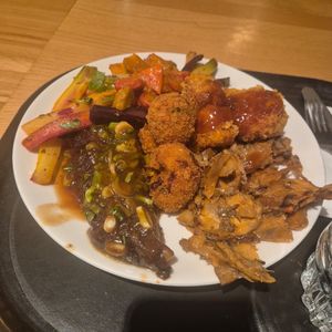 Mixed Carrots, Seitan Steak Umami Sauce, cauliflower tempura, mixed mushroom salad at Spirit in Amsterdam