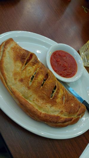Pepperoni sausage n jalapeño calzone at Razzi's Pizzeria - Howell St in Seattle