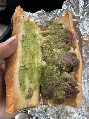 What is the green stuff on a cheesesteak? And red onions?  at Razzi's Pizzeria - Howell St in Seattle