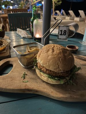 Veggie burger and fries (half eaten).  Requested no cheese to hopefully make it vegan...  at Bale Sampan in 