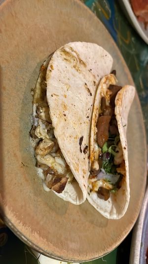 Quesadilla de tofu en salsa verde y de birria  at La Flaca - Americana in Guadalajara