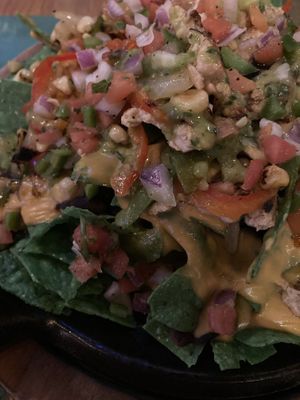Lighting is low, but vegan chick’n nachos  at Nacho Daddy - Summerlin in Las Vegas