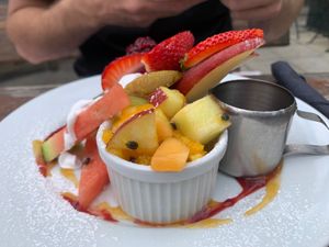Buckwheat, chia, flax seed & almond meal creamy coconut pancakes with maple, banana, fresh fruit, berry compote & coconut cream. at Powerhouse Cafe in Hanmer Springs