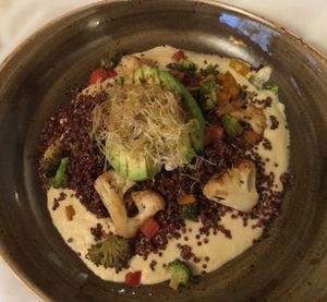 Avocado Kamau-A blend of Caribe' Spices with red quinoa, broccoli, cauliflower, bell pepper, fresh avocado and vegan alfredo.  at Cherie Inn in Grand Rapids
