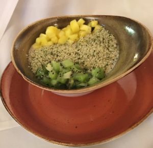 Kiwi Twister Smoothie Bowl-Non dairy yogurt with strawberries and chia seeds topped with kiwi, pineapple and hemp hearts. at Cherie Inn in Grand Rapids