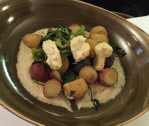 Spartan Spuds-Broccoli, spinach, green peppers on organic potatoes topped with vegan boursin cheese. at Cherie Inn in Grand Rapids