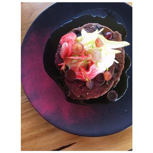 Banana buckwheat cinnamon pancakes w coconut yogurt and fruit. at Onda Food House in Aireys Inlet